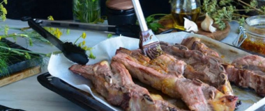 Basting ribs with Don Esteban salmuera on the grill